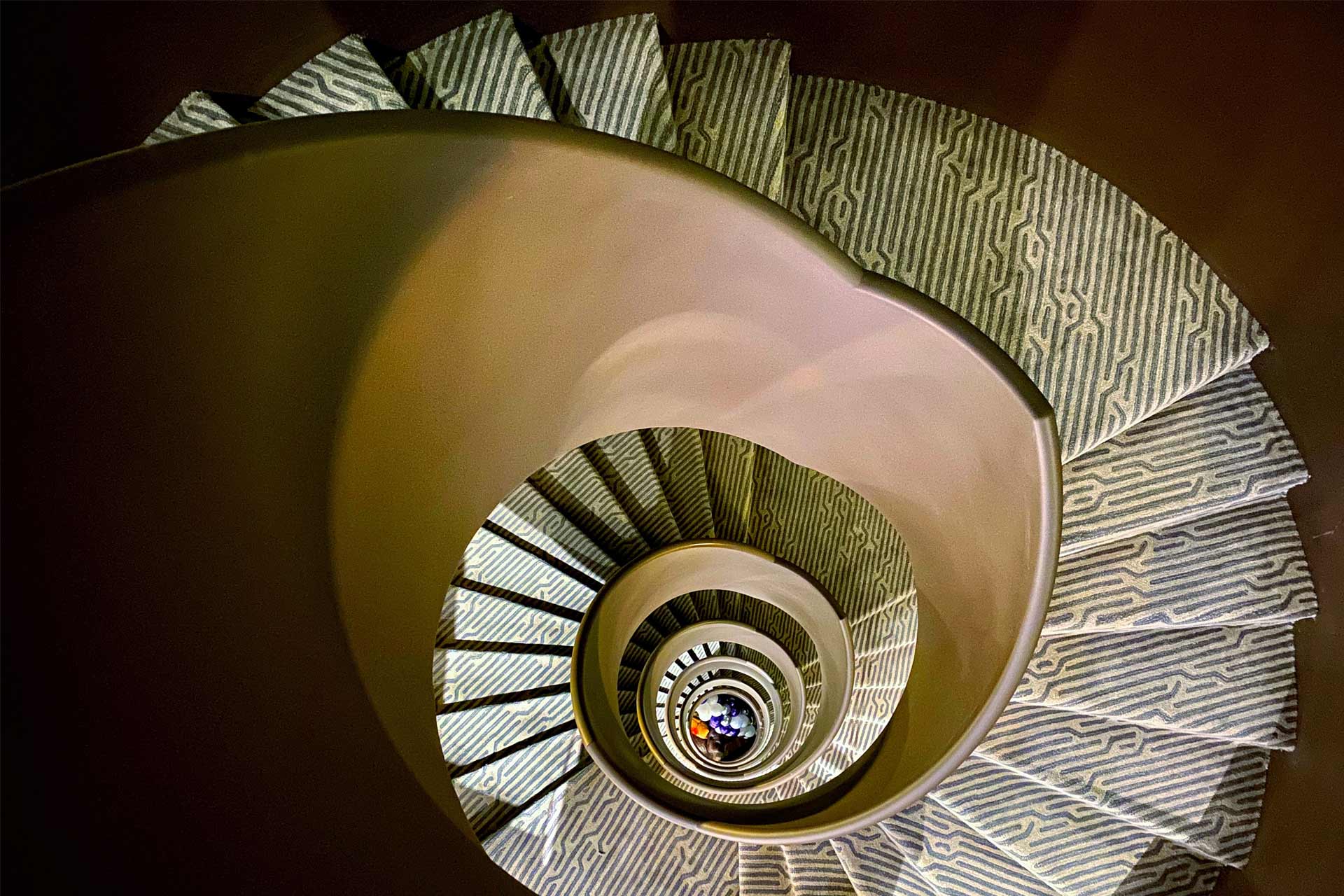 An interior shot of the spiral staircase at Stock Exchange Hotel in Manchester